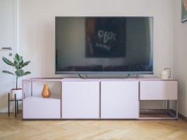 Bespoke furniture object combining steel structure, cabinets and shelving